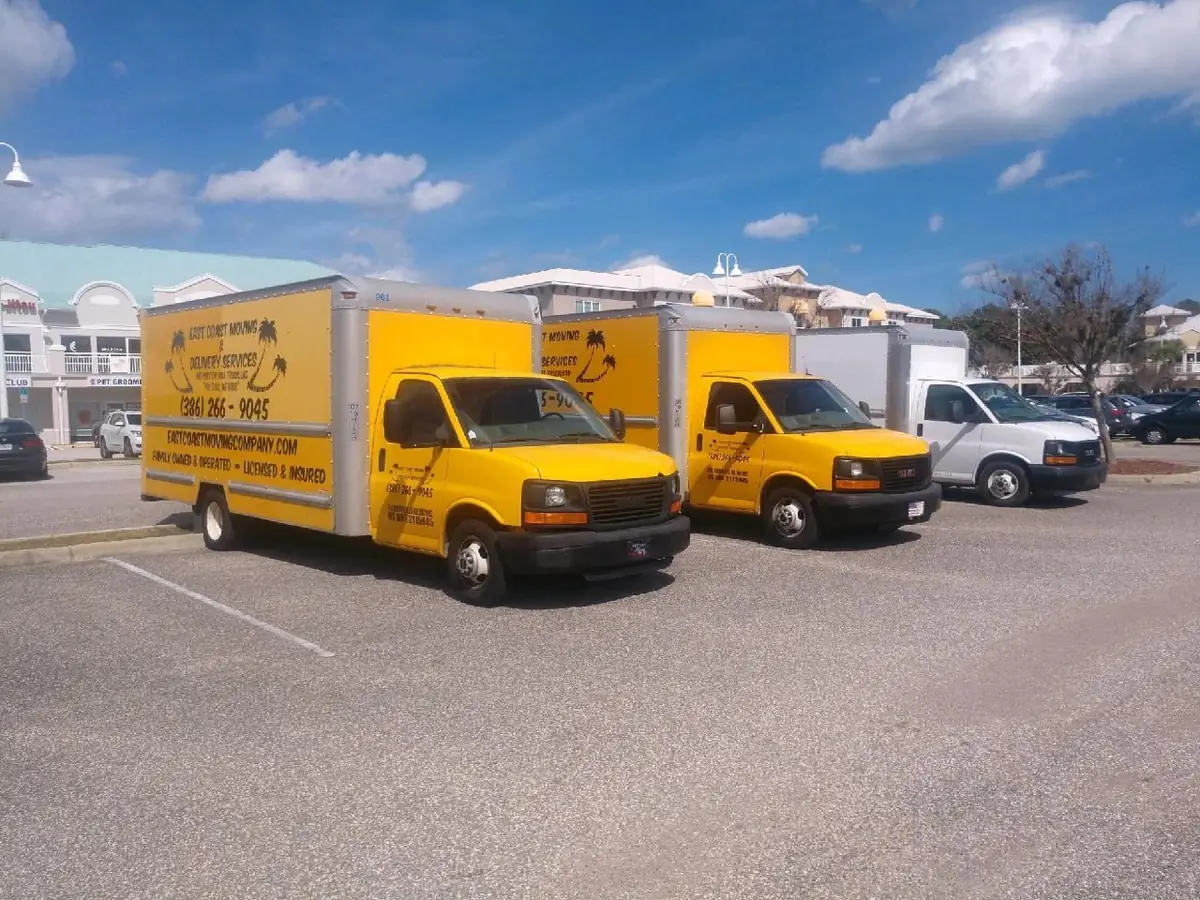 Three East Coast Moving box trucks lined up